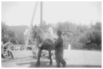 Esther får en tur på en af bøndernes heste, Ove styrer tingene. 1941.