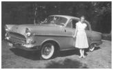 Esther foran den nye bil ,en Opel Kaptein. Vores forældre var velhavende.
