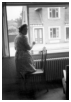 Astrid pudser vindue, overfor boede "Hat Marie", hun handlede selvfølgelig med hatte, da hun opgav sin butik, lejede vores forældre butikken og udstillede cykler har.1959.