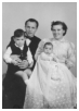 Frantz og Jytte med deres to børn - Tonny og Frank i dåbskjolen som Jytte har hæklet - 1958